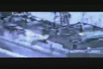 Pirates fire at a U.S. Navy SH-60B Sea Hawk helicopter