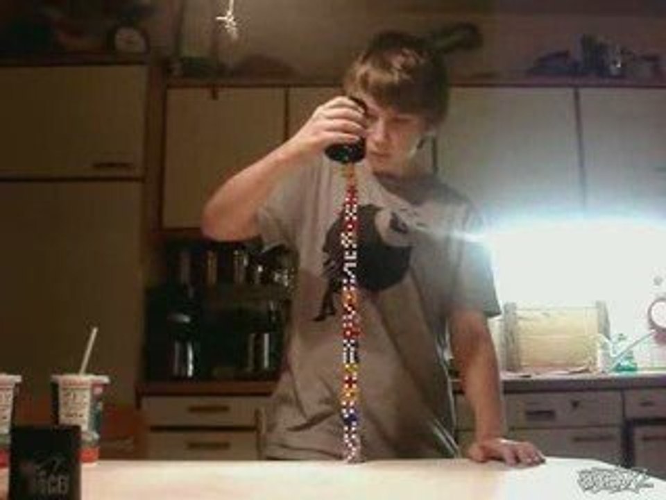 Guy stacks 14 pairs of dice