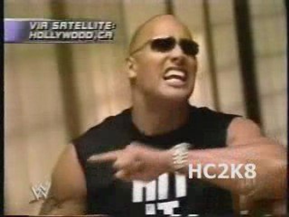 The Rock talks trash about the crowd and Hogan.