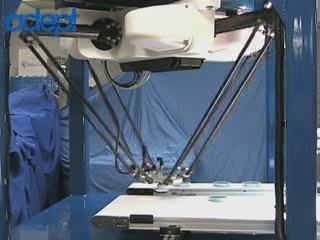 Adept Quattro 650 robot handling petri dishes