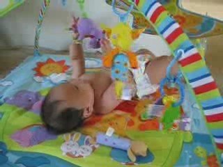 Alek playing on mat