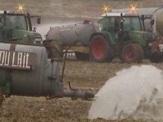 Belgian Farmers Protest with Milk Spray 🥛