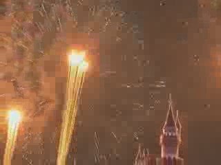 Man watches fireworks from the Disneyland castle