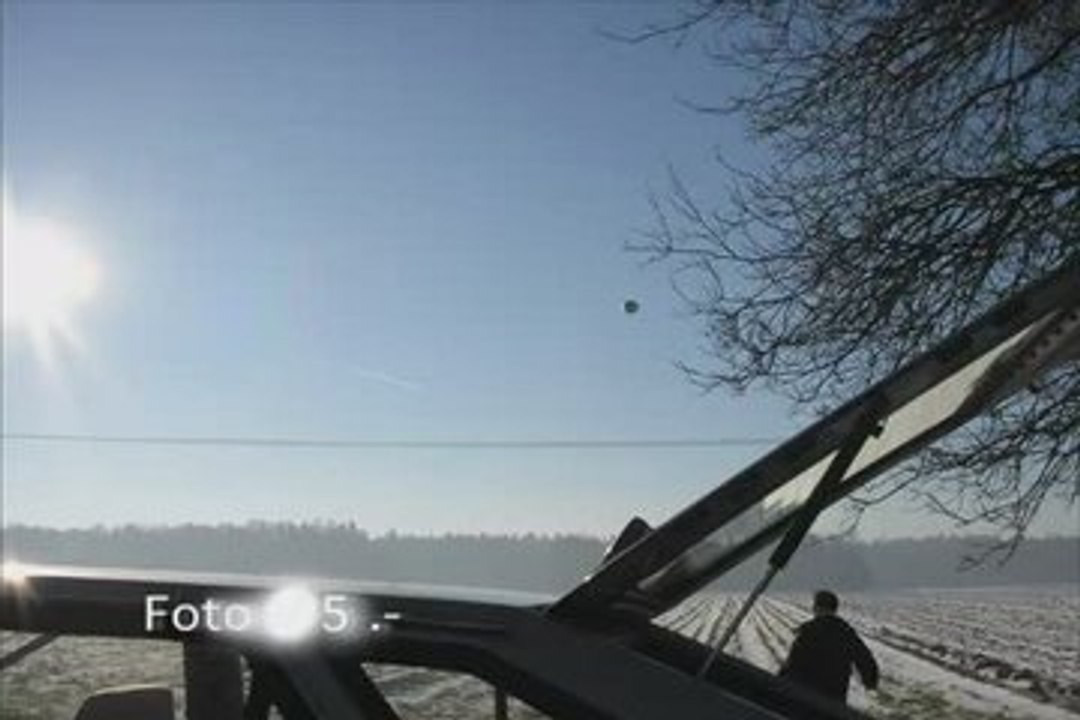 UFO CAUGHT ON TAPE HOVERING OVER FARM FIELDS Video