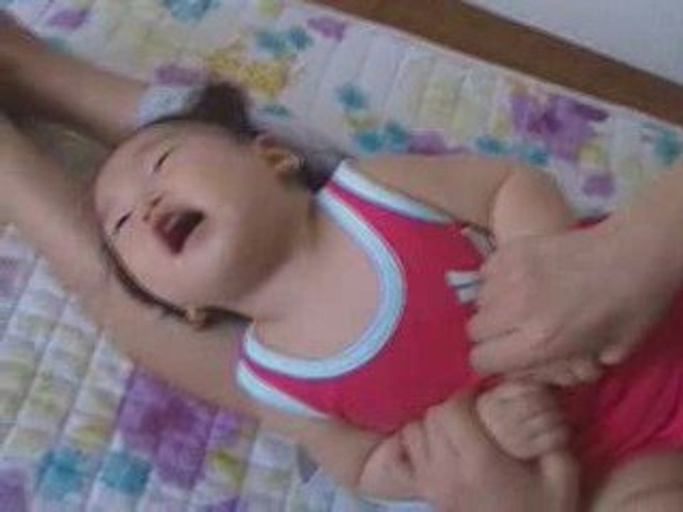 Baby Mideum being tickled and laughing hysterically