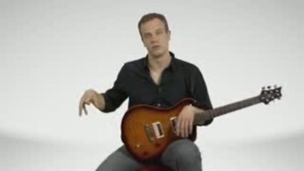 How To Hold An Electric Guitar - Guitar Lessons