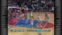 NBA Ryan Hollins throws it down amongst two defenders.