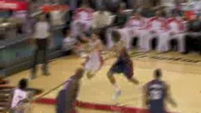 NBA Andrea Bargnani blows by Anderson Varejao for the dunk.