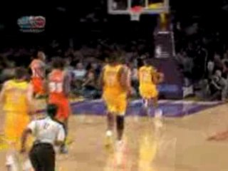 NBA Shannon Brown floats in the air for the powerful dunk.