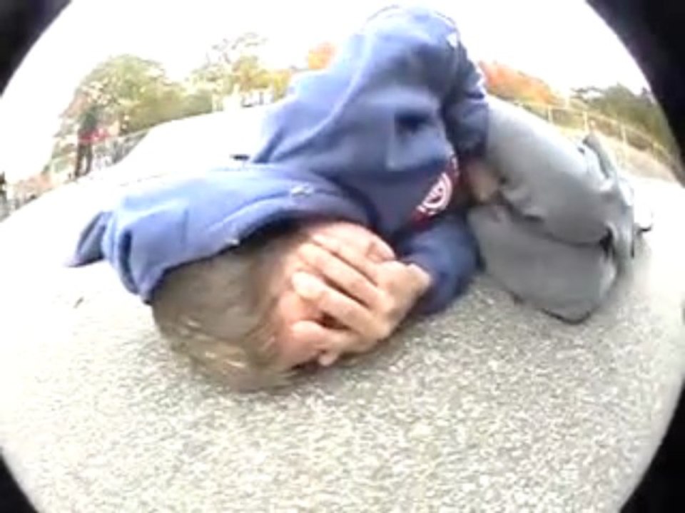 Skater takes a rail to the balls