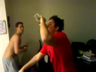Guy chuggs a fifth of vodka in 2 minutes