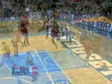 NBA Carmelo Anthony goes right through the lane over Taj Gib