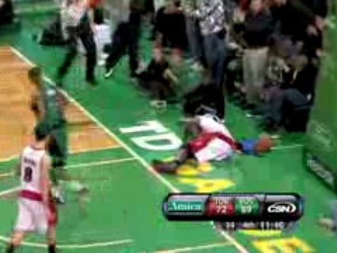 NBA Paul Pierce throws down a powerful dunk against a defens