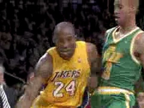 NBA Kobe hangs with it and gets the tough layup to fall.