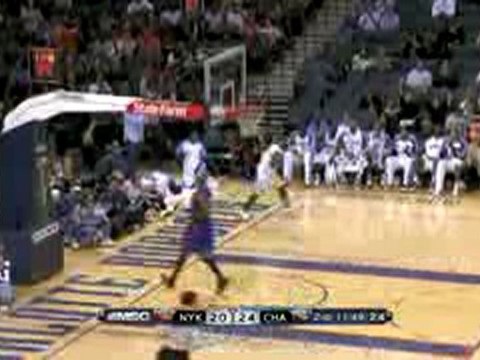 NBA Gerald Wallace throws down a windmill jam on the break w