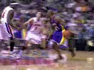 NBA Kobe Bryant finds his way into the lane and finishes wit