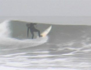 Funny Santa Surfing and ripping a few waves