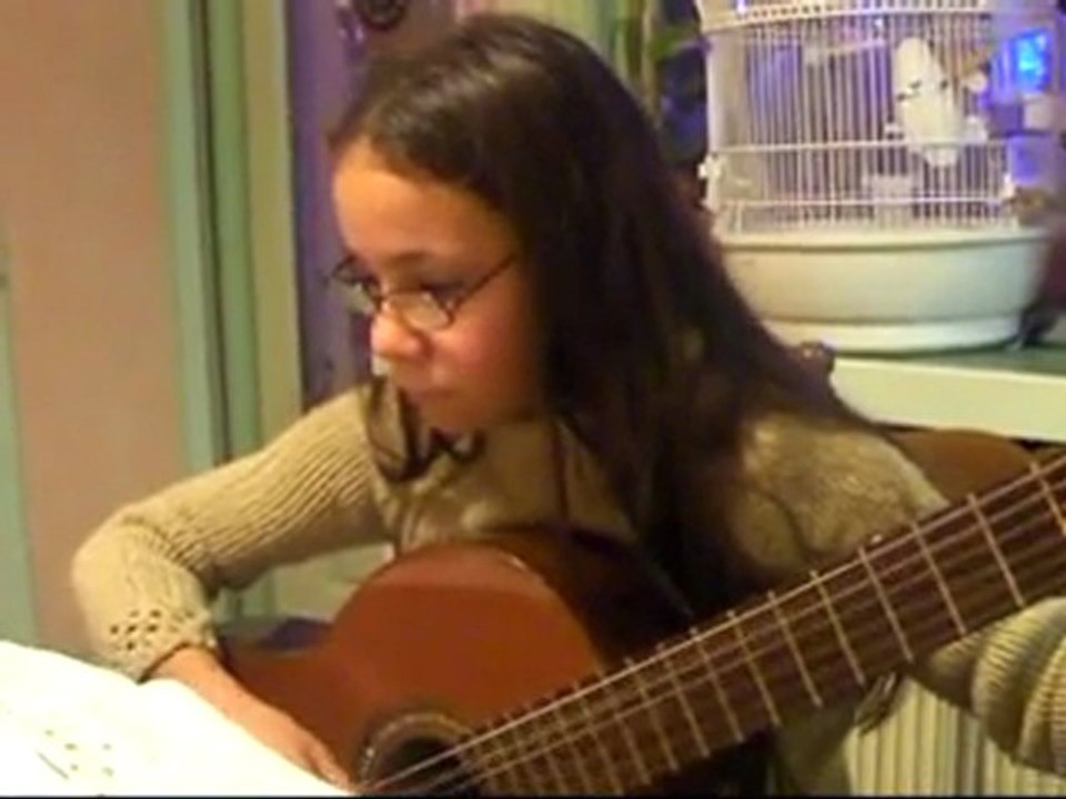 Maeva ,11,plays the guitar/ Maeva joue de la guitare