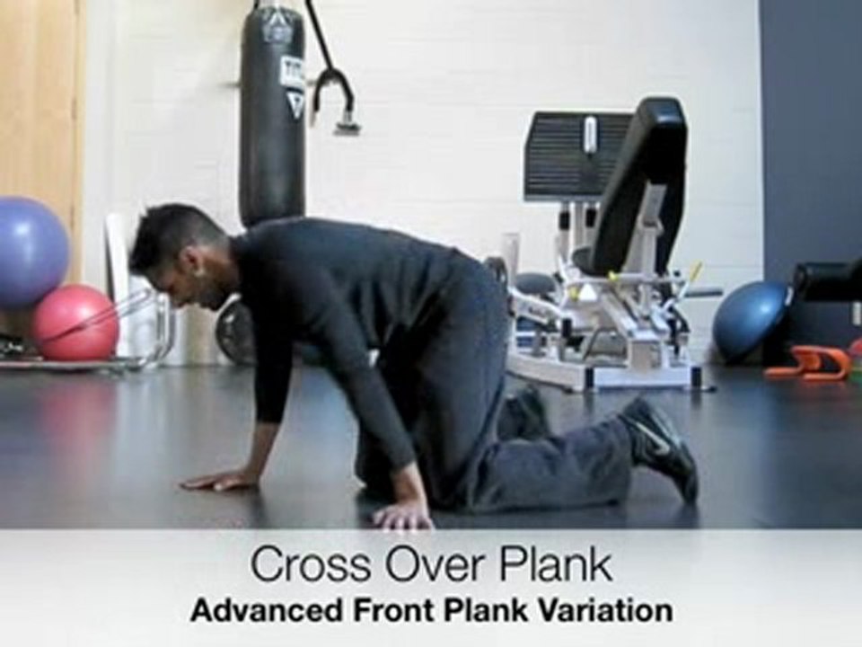 Toronto Physiotherapist Performs Cross Over Plank Exercise