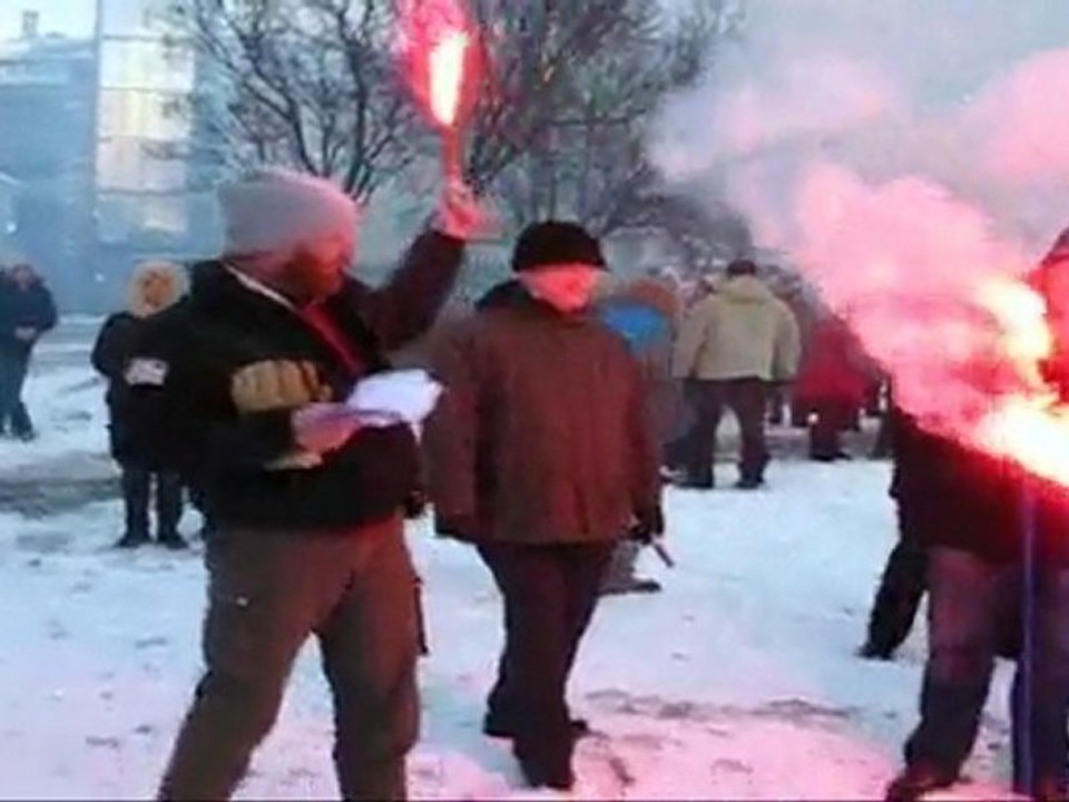 Red flares lighted at a protest in ICeland