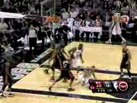 NBA Tim Duncan throws a nice pass to rookie DeJuan Blair, wh