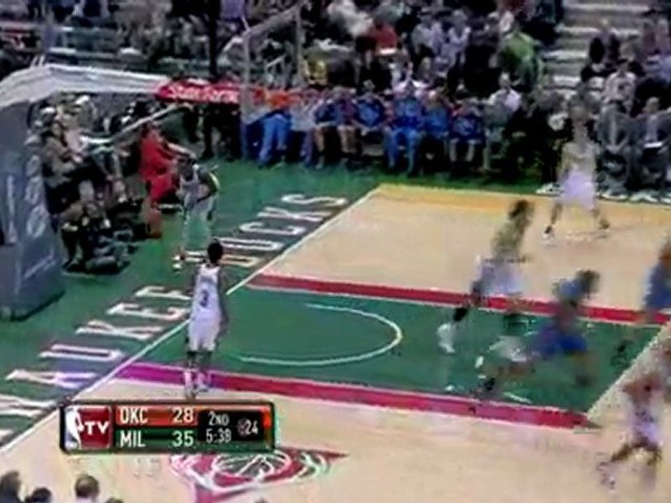 NBA Kevin Durant drives past a defender and finishes with au