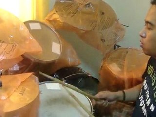 Chris Veloso playing drums ( Moonpools and Catterpillars )