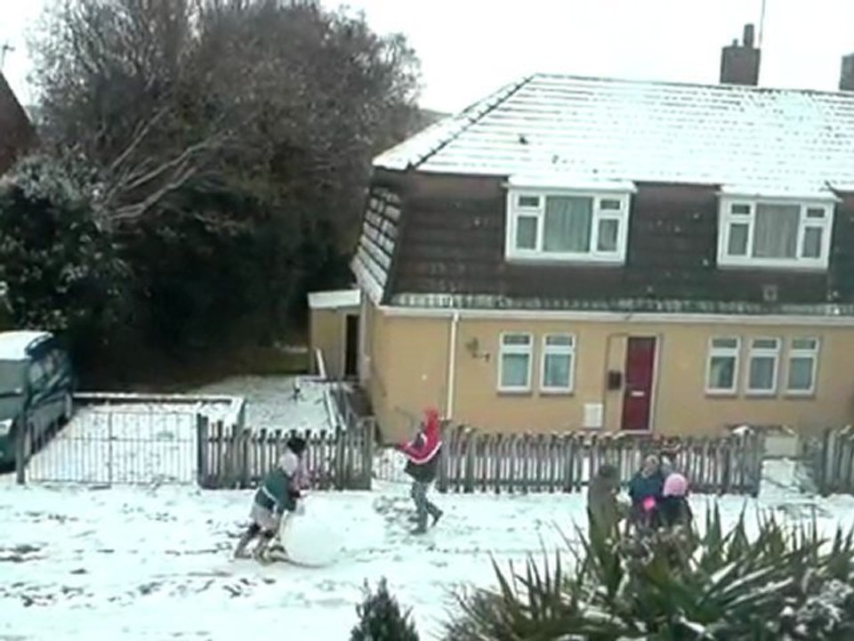 children building a snowman in newton abbot