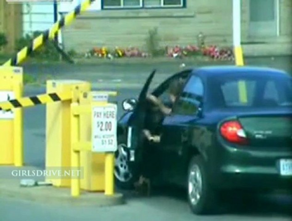 Girl trying to pass automatic barrier