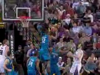 Dwight Howard elevates and snatches Andres Nocioni's floater