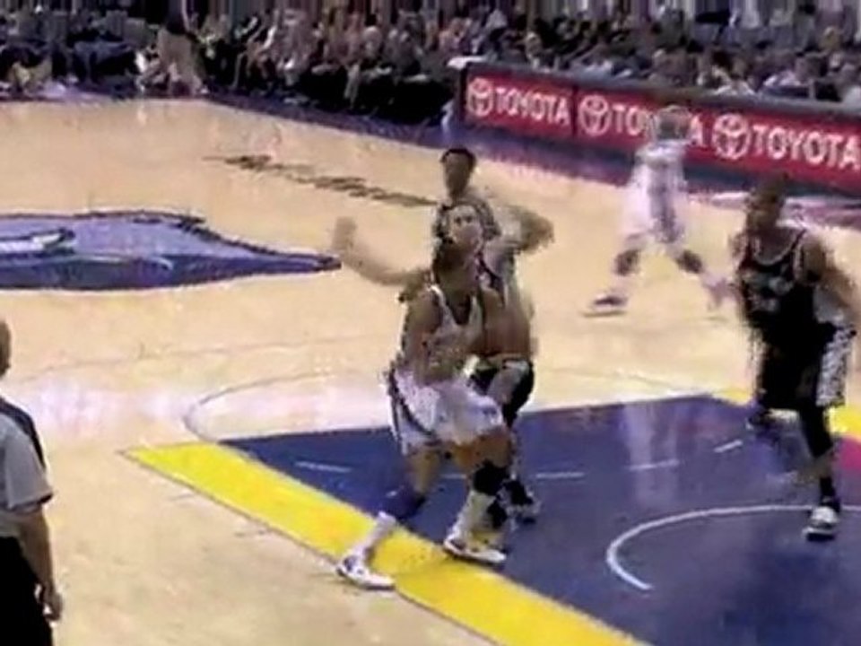 Tim Duncan blocks Rudy Gay's layup attempt into the stands.