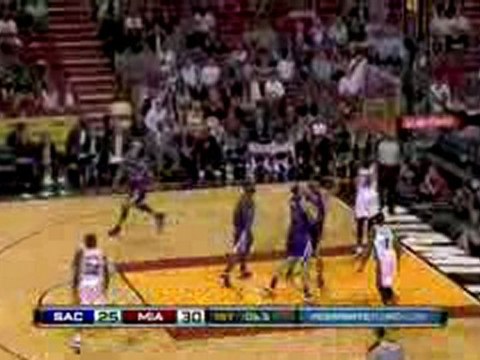 Dwyane Wade grabs the board and throws it down.