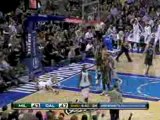 Dirk Nowitzki goes up for the slam while being fouled and st