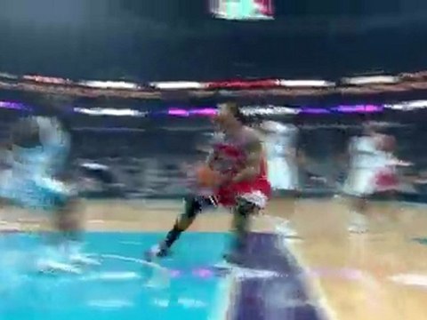Derrick Rose drives the lane and finishes with a two- handed