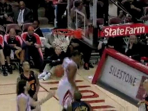Shane Battier slides a pass down low to Chuck Hayes who gets