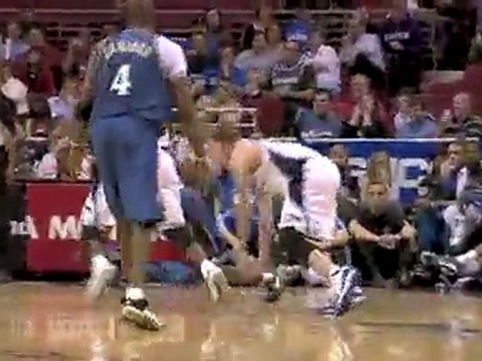 Earl Boykins drives to the basket but Dwight Howard blocks h