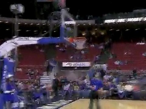 Dwight Howard sinks a pre-game shot while sitting on the ben