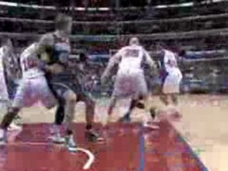 Mehmet Okur gets the pass from Deron Williams and goes to th