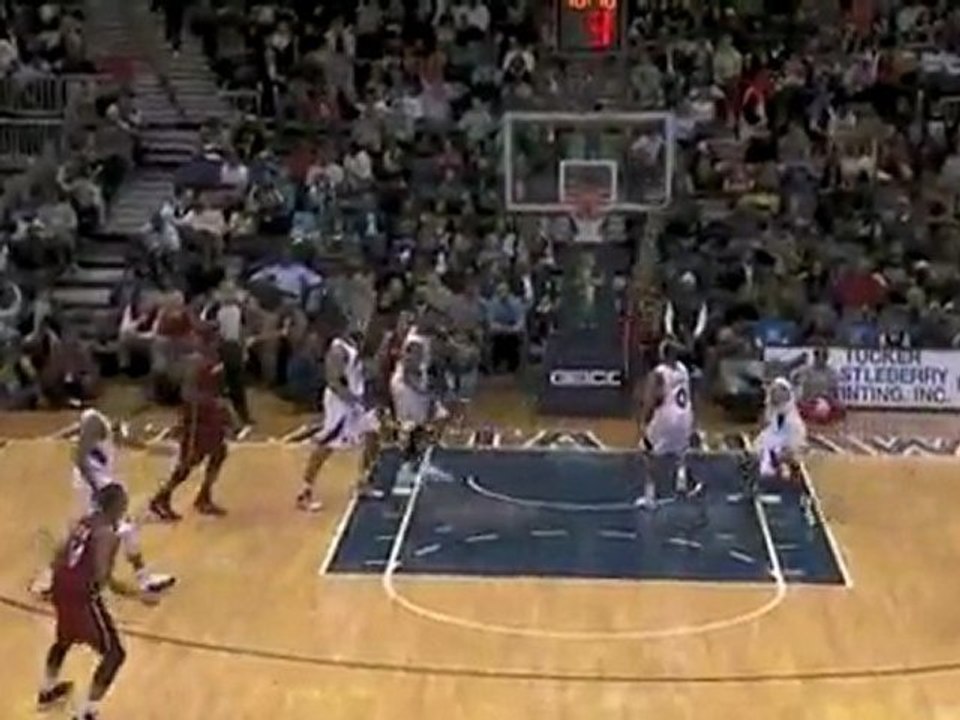 Carlos Arroyo throws up a wild shot over the rim but Udonis