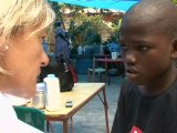 A month after the quake, massive aid effort continues for Haitian children and families