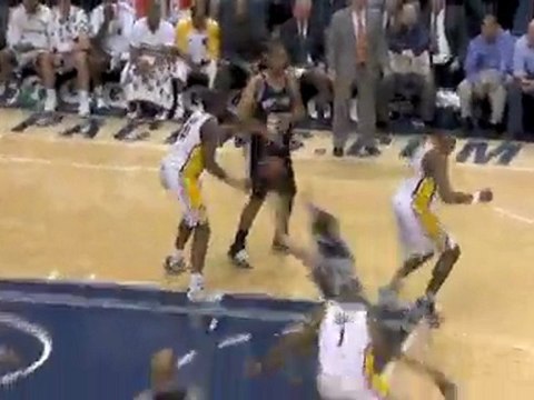 Tim Duncan finds a cutting Manu Ginobili in the lane for the