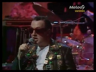--duo --Coluche et eddy Mitchell (1980)-" c"est un Rocker."