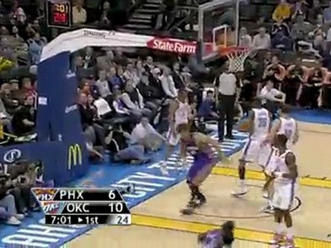 Goran Dragic hangs in the air and throws up a shot that find