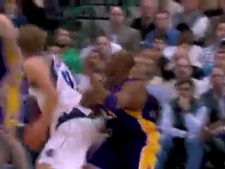Kobe contests Dirk's shot but the Mavs big man gets the bask
