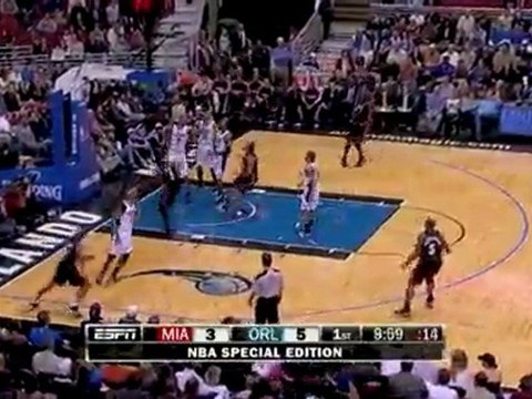 Dwyane Wade drives baseline for the reverse jam.