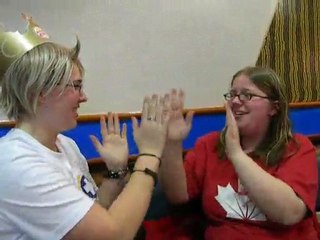 America and FemaleCanada playing with their hands