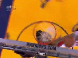 Monta Ellis spins around Batum and goes strong to the hole.