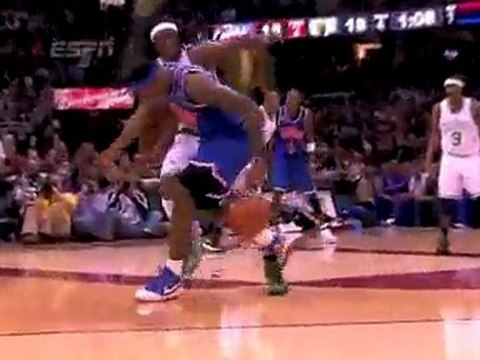 LeBron James throws in a three-point shot to beat the buzzer