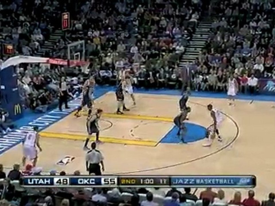 Kevin Durant knocks down a long jumper over C.J. Miles.