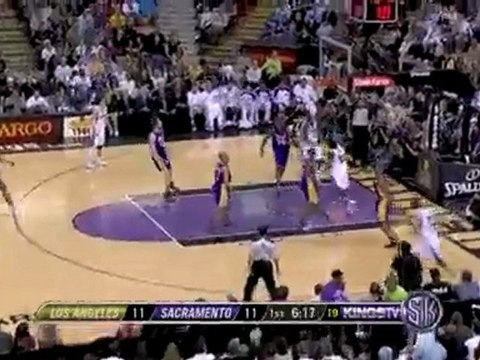 Tyreke Evans spins right past Ron Artest for two points.